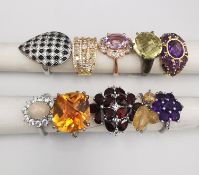 A collection of ten silver and gold plated silver dress rings some set with gemstones, including