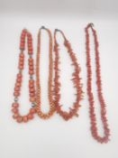Three vintage coral bead necklaces and a Chinese silver and coral bead necklace. One of the