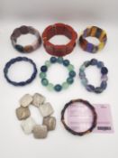 Eight gemstone bracelets, one with a certificate. Gemstones include Jasper, fossilized coral