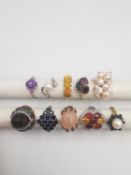 A collection of ten silver and gold plated silver dress rings some set with gemstone and