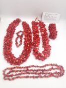 A collection of 20th century coral jewellery, including a statement coral drop shape bead