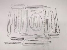 A collection of thirty three 20th century silver chains and necklaces of various designs and