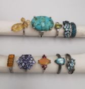 A collection of ten silver and gold plated silver dress rings some set with gemstones, including
