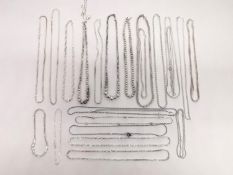 A collection of twenty three 20th century silver chains and necklaces of various designs and