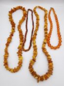 Four amber necklaces, including two amber chips necklaces, a graduated amber bead necklace and an