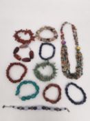 Ten gemstone bracelets and a multi gemstone chip and crystal bead multi strand necklace. Bracelets