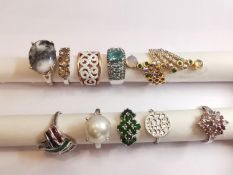 A collection of ten silver and gold plated silver dress rings set with various gemstones,