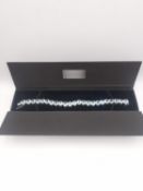 A silver articulated pale blue gemstone set bracelet. Set with twenty three round mixed cut stones