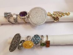 A collection of ten silver and gold plated silver dress rings some set with gemstones, including