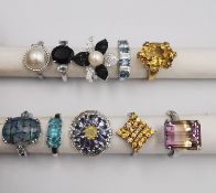 A collection of ten silver and gold plated silver dress rings with certificates. All set with