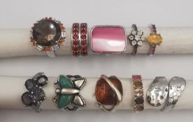 A collection of ten silver and gold plated silver dress rings some set with gemstones and with