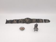 A collection of silver jewellery, an Egyptian design wirework panel bracelet, a Moses in the