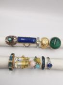 A collection of ten silver and gold plated silver dress rings some set with gemstones, including,