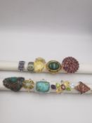 A collection of ten silver and gold plated silver dress rings some set with gemstones, including
