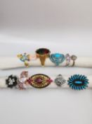 A collection of ten silver and gold plated silver dress rings some set with gemstones, including