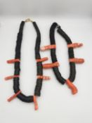 Two statement coconut shell disc and orange branch coral tribal necklaces. Both fasten with a
