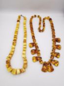 Two amber necklaces, one with cube beads and the other with a graduated fan design. L.70cm