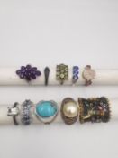 A collection of ten silver and gold plated silver dress rings some set with gemstones, including
