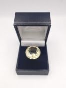 A statement Citrine yellow metal dress ring, set with a round mixed cut Citrine with an