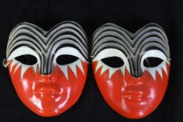 A pair of carved wooden Chinese lacquered masks. Twentieth century. H.20 x W.17 cm.