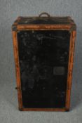 A vintage fitted leather and metal bound steamer trunk. H.100 W.58 D.43cm.