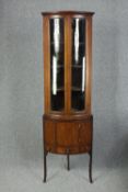 Corner cabinet, Edwardian mahogany and satinwood inlaid of bowed outline with bowed glazed panels.