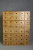 Spice cabinet, C.1900 pine, full height floor standing with faint numbering to each drawer. H.155