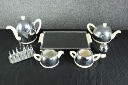 An Everhot tea set to include tea and coffee pots, a milk jug and sugar bowl along with a non