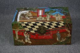 A vintage Chinese travelling chest with painted decoration. H.31 W.70 D.46cm.