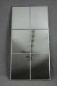 A large metal framed mirror. H.180 W.90cm.