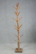 An Eastern hardwood full height coatstand. H.206cm.