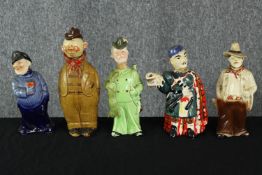 A collection of five vintage hand painted ceramic decanters modelled as various figures, including