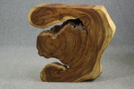 A console table cut from a section of exotic hardwood. Oiled and waxed, unique. H.88 W.95 D.20cm.