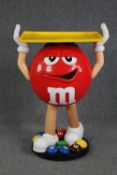 Advertising. An M&M chocolate display character on casters. H.102 W.70 D.40 cm.