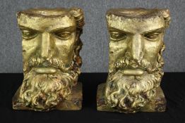 Two gilt resin busts. Sections of classical faces. each measures H.40 W.30 D.28 cm.
