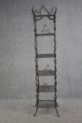 A floor standing iron plant rack or shelves. H.183 W.34 D.34 cm.