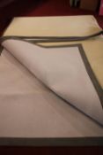 A large contemporary flatweave carpet with stitched border. L.405 W.315cm.
