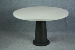 A Kops dining table by Van Rossum, contemporary oak and metal. H.74 Dia.120cm.