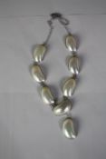 A J. Francis boxed turban shell section and silver statement necklace with hook fastening. Pendant