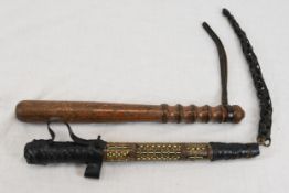 A well decorated Syrian camel whip and a policeman's truncheon. Circa 1930.