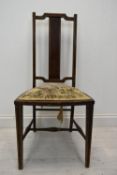 An Edwardian bedroom chair. H.97cm.