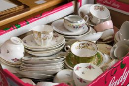 A mixed collection of various tea sets. In varied styles and patterns.