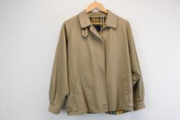 A vintage Burberry short jacket with tartan lining.