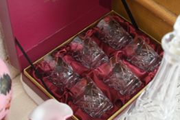A set of whiskey tumblers and five 19th and 20th century cut glass decanters. H.39 W.12 cm