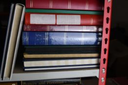 A collection of unused and empty stamps albums. Some still in publishers seal. Largest measures L.31