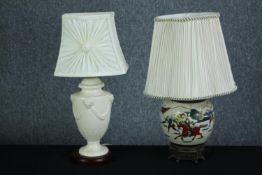Two table lamps. One baroque in style with a patterned shade. The other Chinese, hand painted and