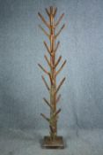 An Eastern hardwood full height coatstand. H.200cm.