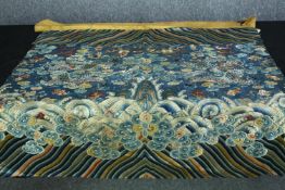 A Chinese 19th century silk hand embroidered apron intricately detailed with a pair of dragons among