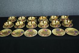 A complete set of gilded Aynsley coffee and tea cups with matching saucers. Six tea cups and