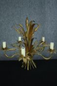 Chandelier with five branches of lights decorated with leaves and husks of wheat or barley around